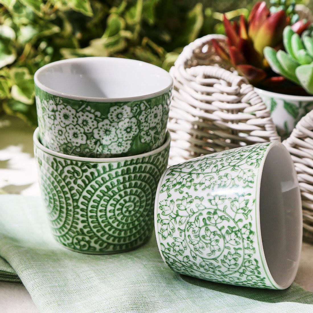 Small green and white vases for tabletop