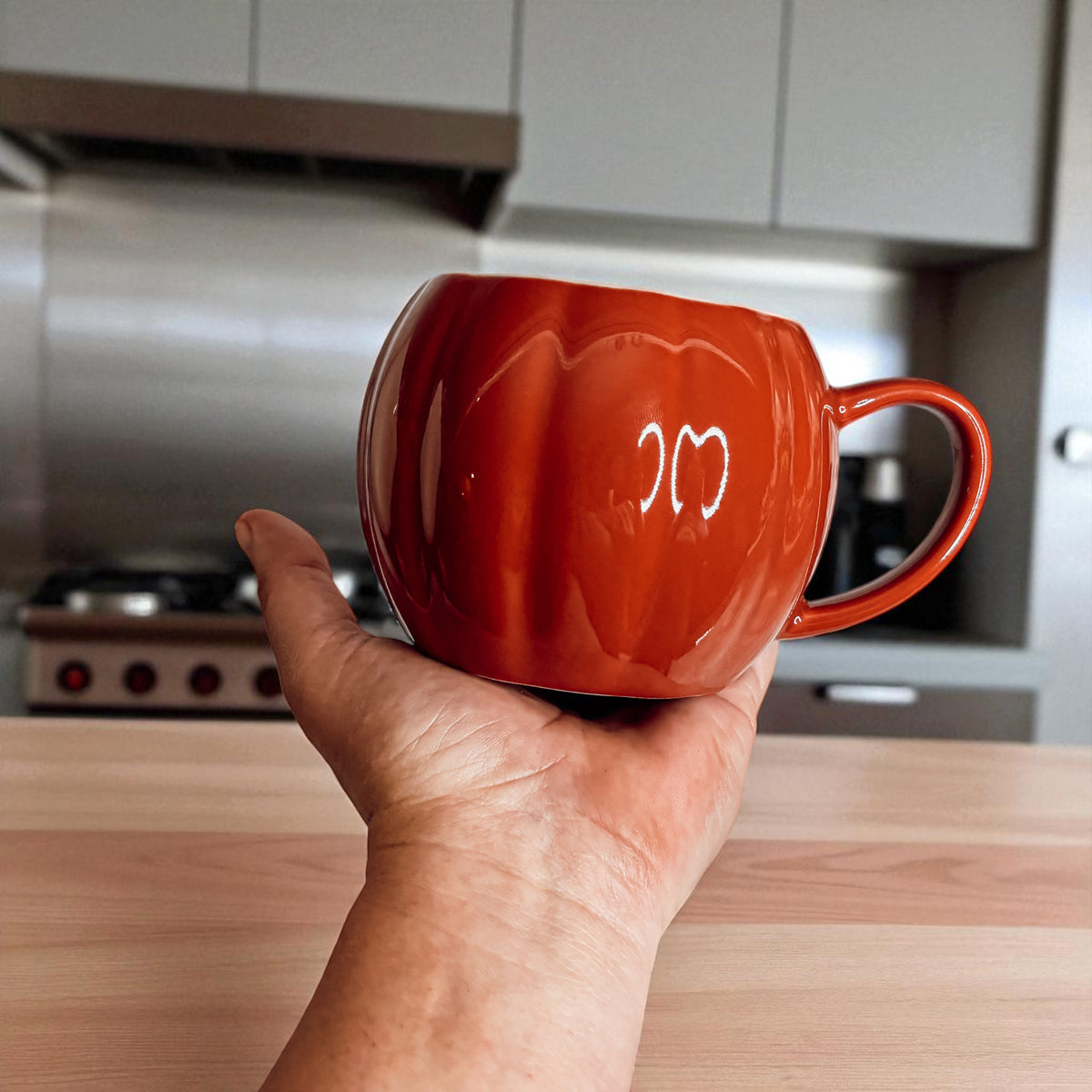 Artisan pumpkin coffee mugs - fall themed ceramic cups for seasonal entertaining
Halloween pumpkin shaped drinkware - white and rust ceramic coffee mugs