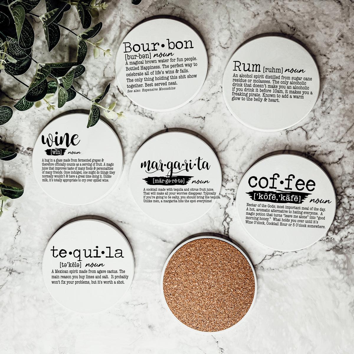 Complete set of drink definition ceramic coasters with cork backing
Bar cart coaster collection featuring funny drink definitions