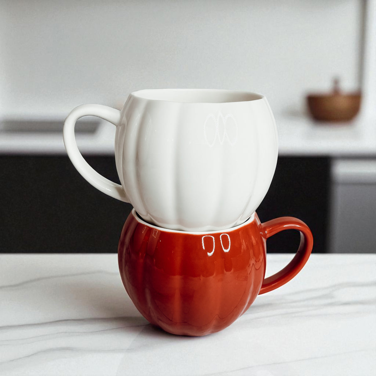 Autumn pumpkin coffee cups - ceramic fall drinkware in white and orange colors
Halloween themed pumpkin mugs - seasonal ceramic coffee cups for home decoration