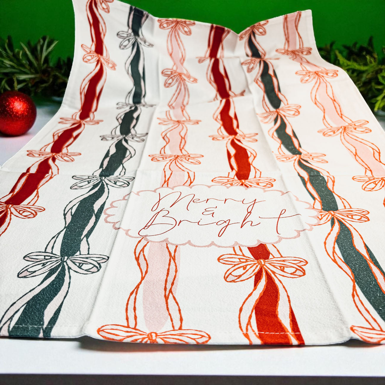 Christmas kitchen towel coquette style
Ribbon bow Christmas kitchen towel
Holiday kitchen linens ribbon design
Christmas kitchen towel elegant bow